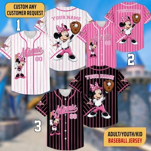 May include: Baseball jerseys featuring Minnie Mouse in various designs. The jerseys are available in white with pink stripes, pink with white stripes, and black with pink stripes. Each jersey has the text "Minnie" and the number "00". The text "YOUR NAME" is also visible.