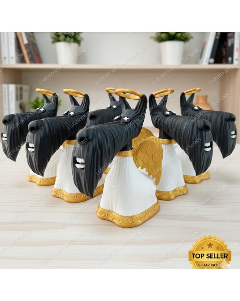 May include: A collection of black dog figurines with gold halos and wings, dressed in white robes with gold trim. The figurines have a Scottish Terrier appearance. The text "TOP SELLER" and "5-STAR RATED" is visible.
