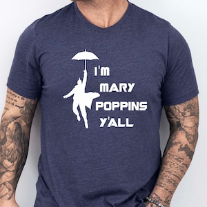 May include: A navy blue t-shirt with a white silhouette of a person holding an umbrella and the text "I'm Mary Poppins Y'all".