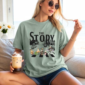 Toy Story t-shirt featuring Buzz Lightyear, Woody, Jessie, and friends crossing the road with traffic cones, inspired by classic Pixar humor. Perfect for Disney family vacations, group matching outfits, or fans of Toy Story nostalgia. Comfortable unisex fit and vibrant design make it a fun choice for park days or themed parties. Great gift for Pixar lovers, kids-at-heart, and family Disney trips.