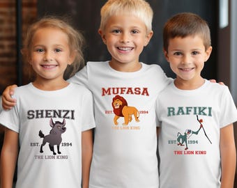May include: Three white t-shirts featuring The Lion King characters. The shirts display the text "Shenzi", "Mufasa", and "Rafiki" with the character's image and the text "Est. 1994 The Lion King".