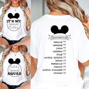 May include: White t-shirt with a black Mickey Mouse head and the text "It's My Birthday" and "Celebrating Around the World". The back of the shirt has a list of countries with a Mickey Mouse head next to each country name.