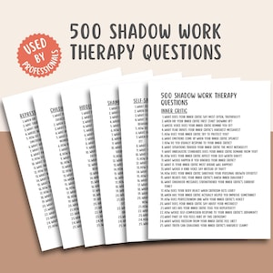 May include: A stack of white cards with black text, titled "500 Shadow Work Therapy Questions." The cards are organized by topic, including "Inner Critic." The words "Used by Professionals" are in a red circle.