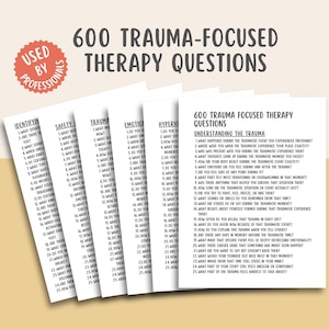 May include: A stack of white cards with the title "600 Trauma-Focused Therapy Questions" and the text "Used by Professionals." The cards contain various questions about trauma, categorized for therapeutic use.