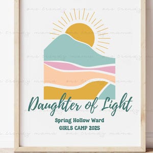 May include: A framed art print with a minimalist design. The artwork features a stylized mountain scene with a yellow sun and text that reads "Daughter of Light". The print also includes the text "Spring Hollow Ward GIRLS CAMP 2025".