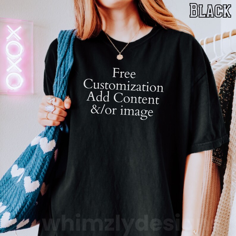 May include: A black t-shirt with the text "Free Customization Add Content &/or image" printed in white.