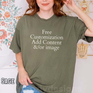 May include: A sage green t-shirt with the text "Free Customization Add Content &/or image" printed in white.