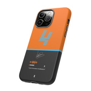 May include: Orange and black phone case with a blue number "4" and a signature. The case has a sound wave graphic and the text "NORRIS" and "I can't, it's broken, it's BROKEN!"
