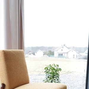 Yellow vintage lounge chair armrests boucle upholstery, walnut wood, Scandinavian design, 1960s