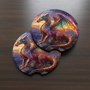 May include: Two round car coasters featuring a colorful dragon illustration. The dragons are depicted with rainbow wings, perched on rocks against a sunset backdrop. The coasters are designed to fit in a car's cup holder.