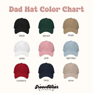 May include: A color chart of dad hats in various colors, including black, spruce, khaki, white, pink, light blue, cranberry, navy, and stone. The text "Dad Hat Color Chart" is at the top, with the GrooveWear Studio logo at the bottom.
