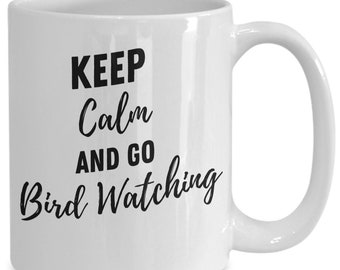 May include: White ceramic mug with the text "KEEP Calm AND GO Bird Watching" in black script. The mug has a curved handle and a glossy finish, perfect for enjoying a hot beverage while bird watching.