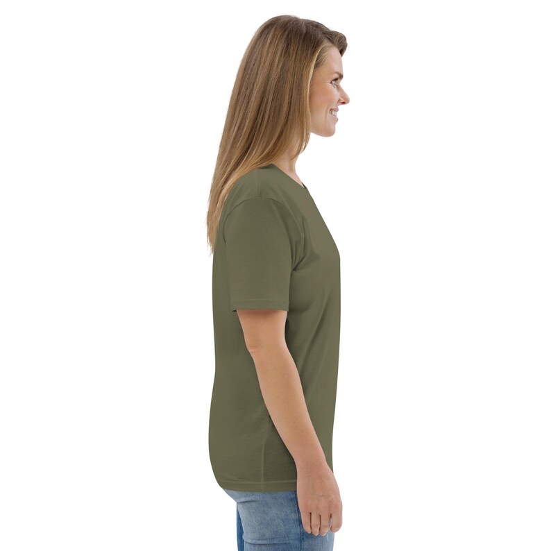 May include: A plain olive green t-shirt with short sleeves. The t-shirt is made of a soft, comfortable fabric.