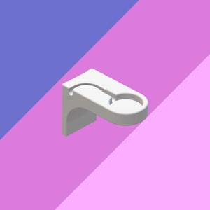 Puede incluir: Soporte de pared de plástico blanco con un gancho curvo y una taza circular. El soporte está diseñado para sujetar una variedad de artículos, como un teléfono, llaves u otros objetos pequeños.