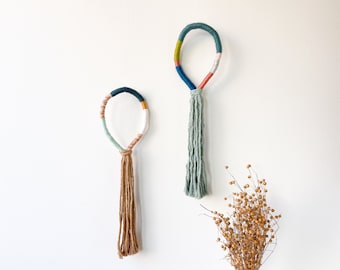 Set of 2 vertical knotted rope art with tassel, Boho rope knots with fringe for wall decor, Small wrapped rope wall knots in pastel colors