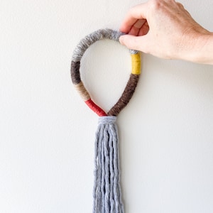 Macrame rope tassel wall decor, Wrapped macrame loop wall hanging, Fringed rope mural art, Grey knotted fiber art