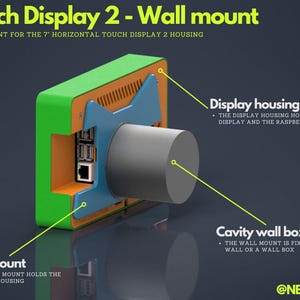 May include: A diagram of a wall mount for a 7-inch horizontal touch display. The mount is green, orange, and blue, with a grey cylindrical component. Text labels identify the display housing, wall mount, and cavity wall box. The text reads "Touch Display 2 - Wall mount".