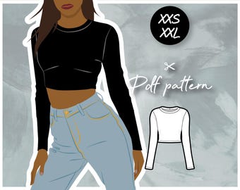 May include: A digital illustration of a woman wearing a black long-sleeved crop top and blue jeans. The image also includes a white long-sleeved crop top with the text "XS-XXL Puff pattern" on a gray background.