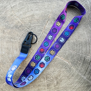 Lorcana Enchanted Keycord 1: TCG, armband, Disney, Mickey Mouse, Elsa, Floodborn, Inklands, Assepoester, Aladdin, Donald, Goofy