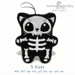 May include: Black and white embroidered cat-shaped ornament with a skeleton design. The cat has a loop for hanging. The text "machine embroidery designs" is at the top. The text "5 Sizes" and file extensions are at the bottom.