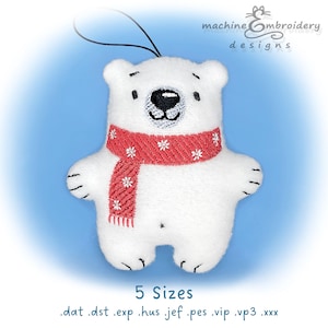 May include: White polar bear plush toy with a red and white scarf. The bear is wearing a red scarf with white snowflakes. The bear is holding a string loop for hanging. 5 Sizes: .dat .dst .exp .hus .jef .pes .vip .vp3 .xxx