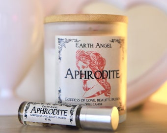 May include: A white candle with a wooden lid and a label that reads "Earth Angel Aphrodite Goddess of Love, Beauty, Passion Spell Candle". There is also a small glass bottle with a label that reads "Earth Angel Aphrodite Goddess of Love, Beauty, Passion 10 ml".