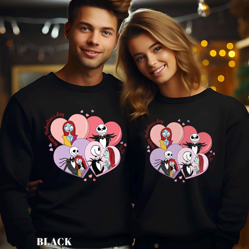 A man and a woman are standing next to each other, both wearing black sweatshirts with a graphic design featuring characters from the movie " Nightmare Before Christmas".