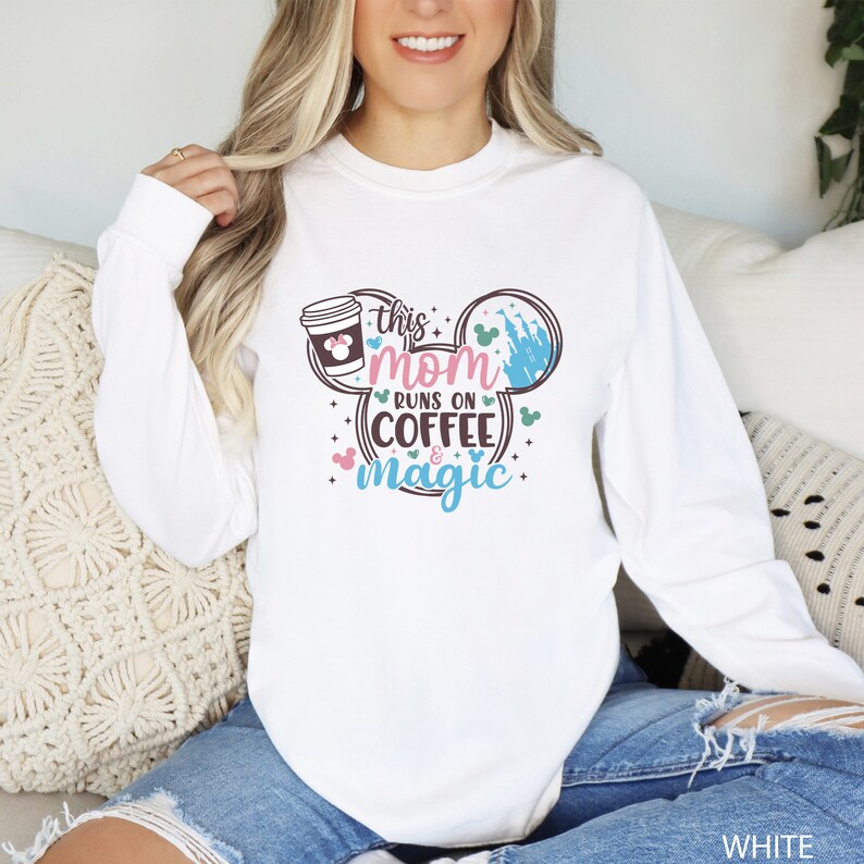 a woman sitting on a couch wearing a white shirt
