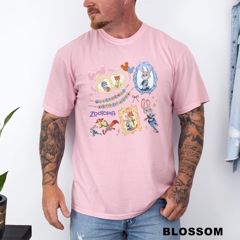 A man wearing a pink t-shirt with a cartoon character design and various other cartoon-style images.