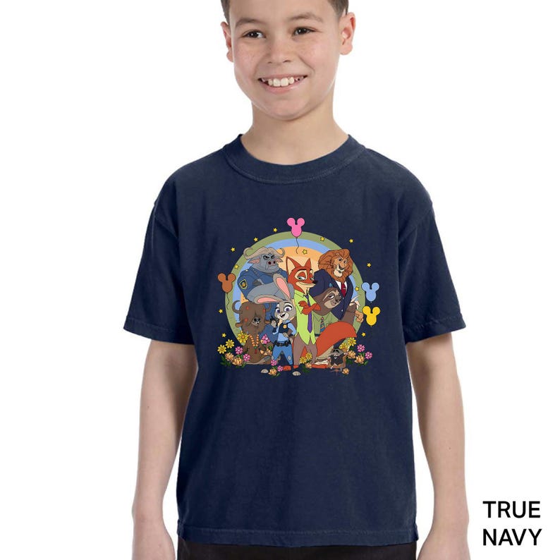 A young boy wearing a navy blue t-shirt with a colorful graphic of cartoon characters from the True Navy series.