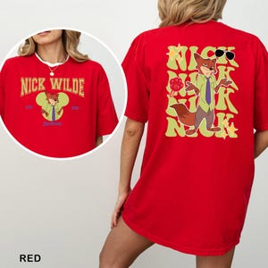 A red t-shirt with a cartoon image of a fox character and text on the back.