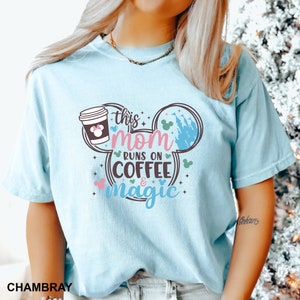 a woman with blonde hair wearing a mickey mouse shirt