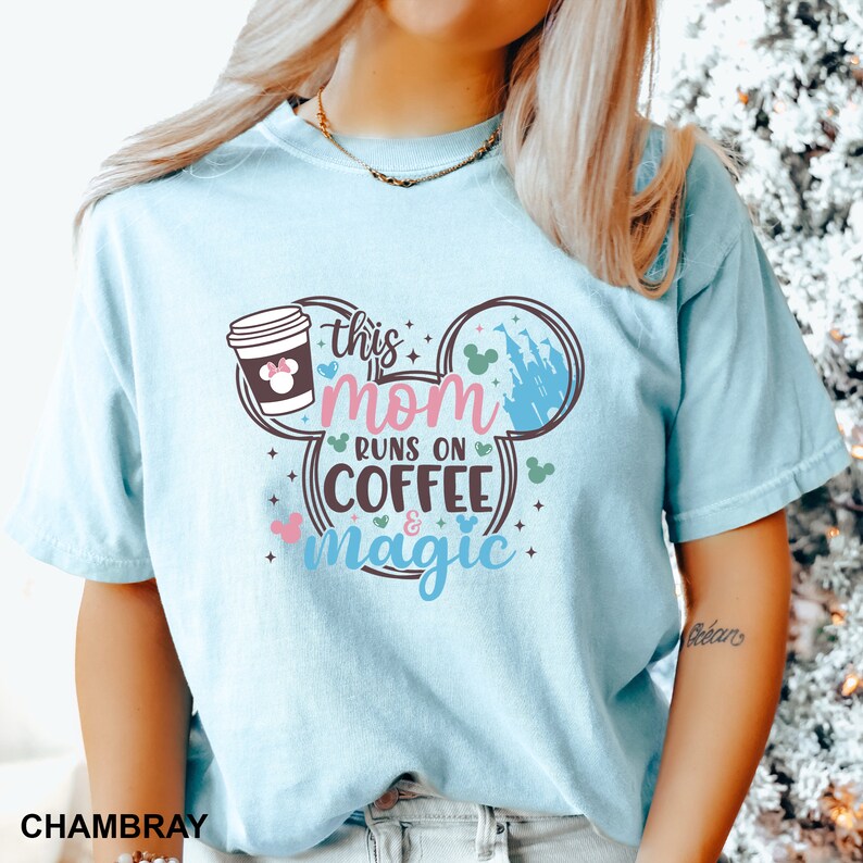 a woman with blonde hair wearing a mickey mouse shirt