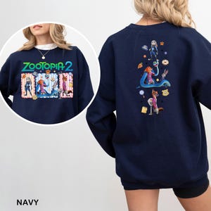 Navy sweatshirt with a colorful graphic design featuring cartoon characters and various other elements.