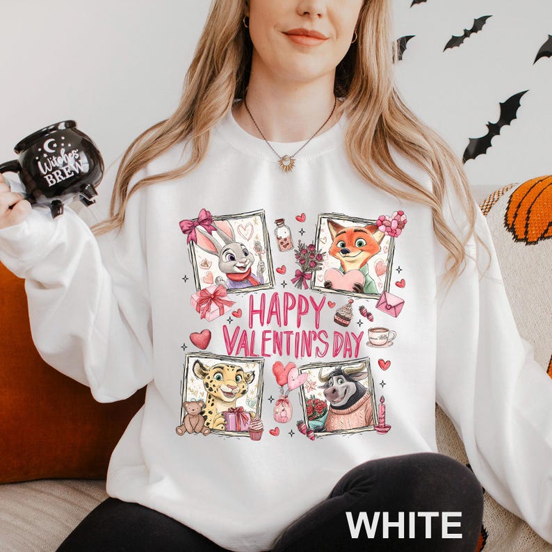 A woman wearing a white sweater with a graphic design featuring cartoon animal characters and the text "Happy Valentine's Day".