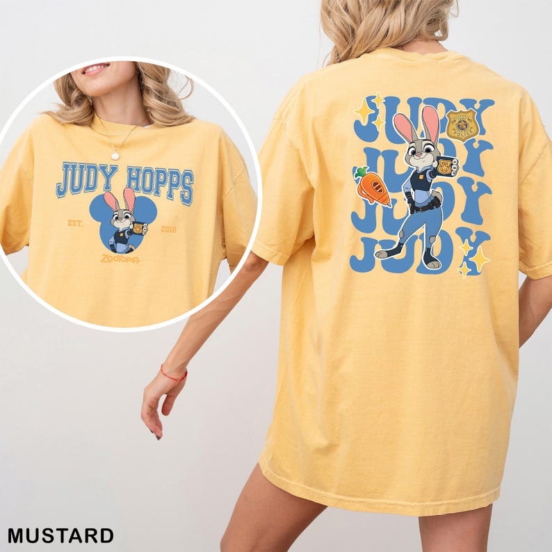 A yellow t-shirt with a cartoon image of a rabbit character and text related to the character Judy Hopps.