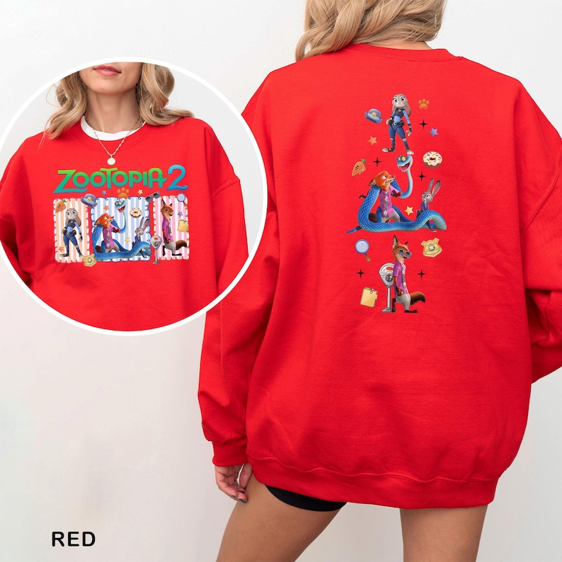 A red sweatshirt with a colorful graphic design featuring cartoon characters and various objects.