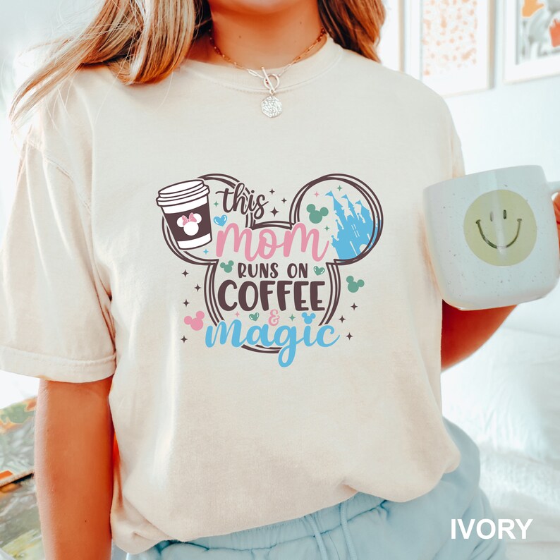 a woman is holding a coffee mug and smiling