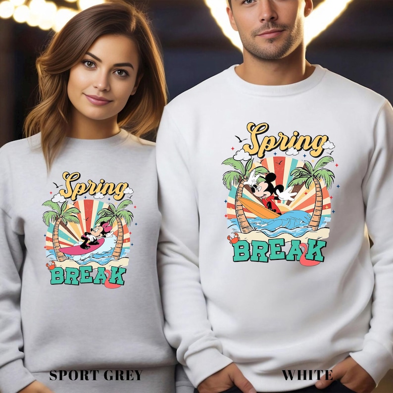 A woman and a man wearing matching white sweatshirts with a spring break theme.