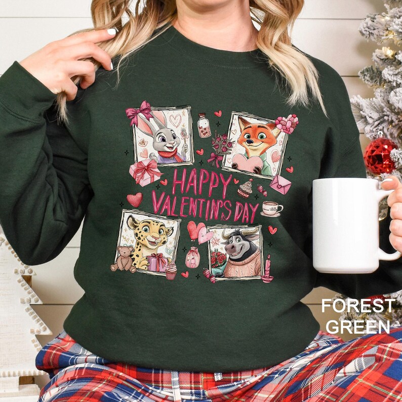 A woman wearing a green sweater with a graphic design featuring cartoon animals and the text "Happy Valentine's Day". She is holding a white mug.