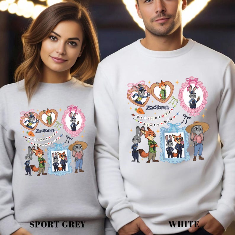Two people wearing white sweatshirts with illustrations of cartoon animals and characters from the movie "Zootopia".