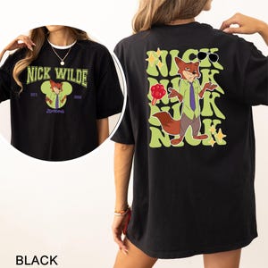A black t-shirt with a graphic of a cartoon fox character and text related to Nick Wilde, a popular cartoon character.