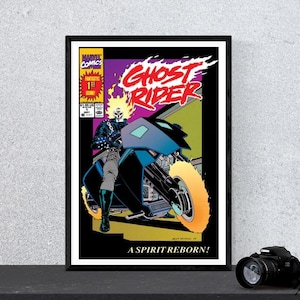 Pode incluir: Uma capa de banda desenhada da Marvel Comics Ghost Rider emoldurada, apresentando uma personagem com uma cabeça de caveira em chamas numa mota azul. O texto diz Ghost Rider, A Spirit Reborn e Marvel Comics. A arte usa cores vivas e marcantes.