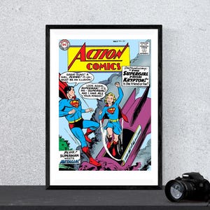 May include: A vintage comic book cover featuring Superman and Supergirl. The cover is red, yellow, and blue with the title "Action Comics" and the text "Introducing: The Supergirl from Krypton! Is she friend or foe?"