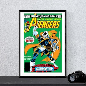 May include: Framed comic book cover of "The Avengers" featuring Taskmaster. The artwork is vibrant with a green background and the character is in a dynamic pose, holding a bow and arrow. The text "TASKMASTER!" is visible.
