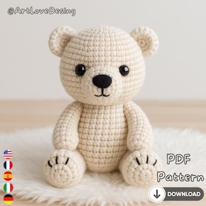 May include: A crocheted teddy bear in cream color with black eyes and nose. The bear is sitting on a white fluffy surface. The image includes the text "PDF Pattern" and a download arrow.