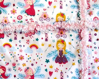Free Australia wide shipping. Pink, purple fairies rag quilt. Cinderella carriages, rainbows, castles and flowers.
