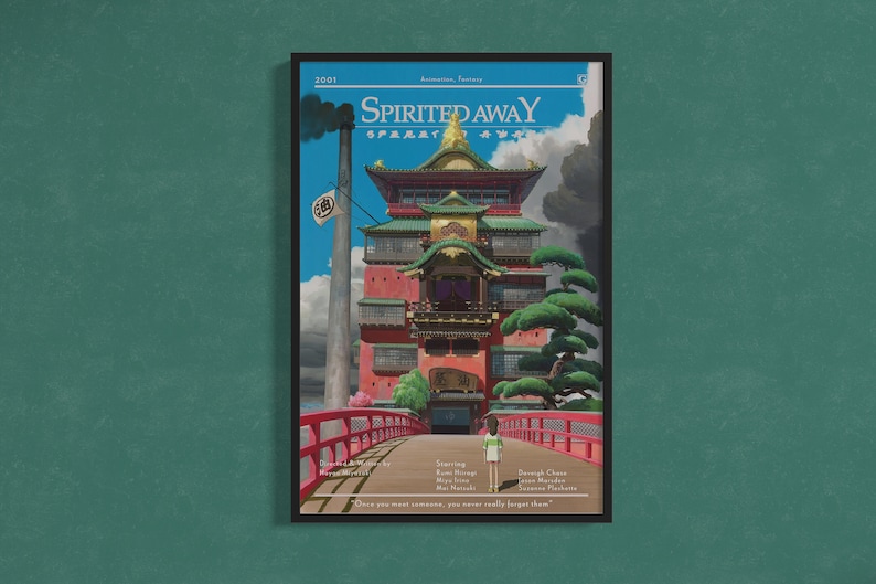 May include: A poster for the animated film "Spirited Away" featuring a red and green building with a bridge leading to it. The text "Spirited Away" is in the top center of the poster. The text "Once you meet someone, you never really forget them." is at the bottom of the poster.