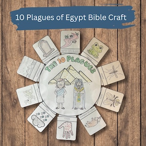 May include: A craft project titled "10 Plagues of Egypt Bible Craft" on a wooden surface. The project features a central circle with illustrations of pyramids, and figures, surrounded by ten cards depicting the plagues, including frogs, gnats, and boils.