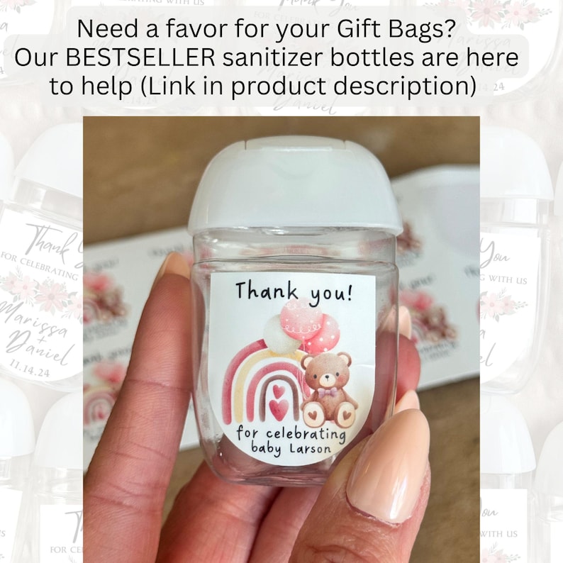 May include: A clear sanitizer bottle with a white cap and a label that reads "Thank you!" with a rainbow, balloons, and a teddy bear illustration. The label also says "for celebrating baby Larson."